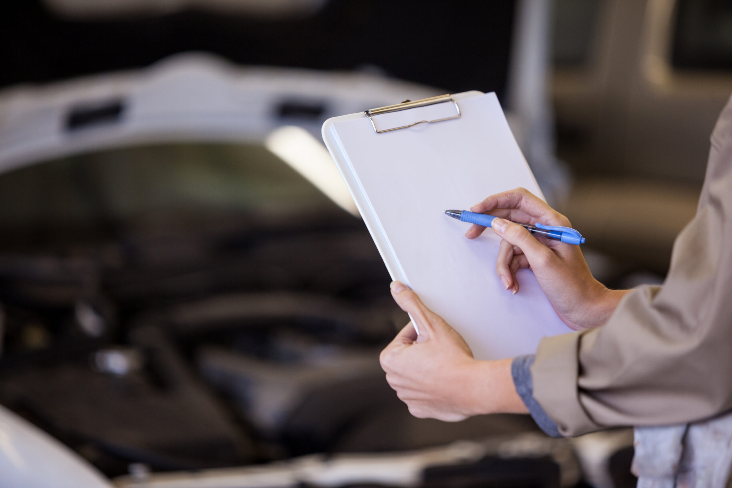 Female mechanic preparing a check list